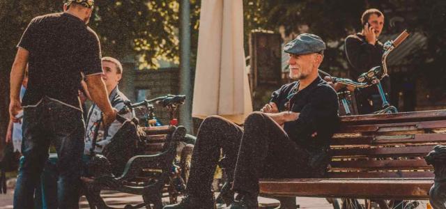 Man sitting on bench in park